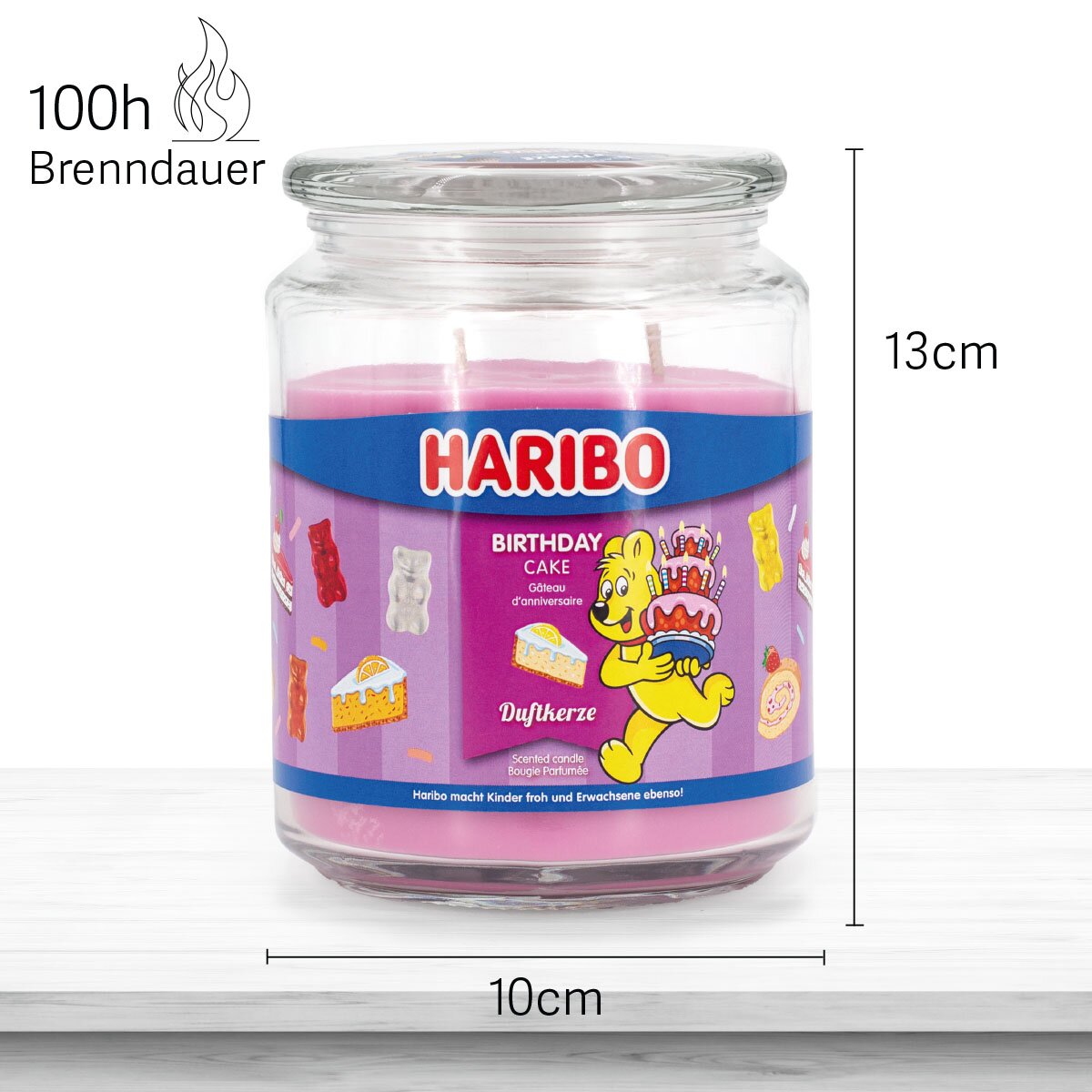Haribo Duftkerze ‚Birthday Cake‘ (510g) im Glas - 13cm hoch, 10cm breit. Offizielle Lizenzkerze mit 100h Brenndauer, angenehmer Duft und liebevolles Haribo-Design. Dekoratives Wohnaccessoire und besonderes Geburtstagsgeschenk.