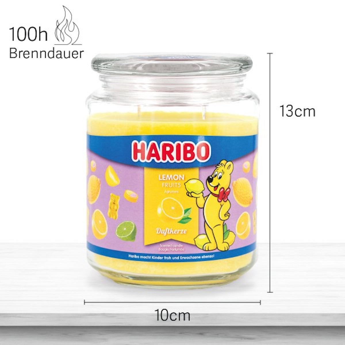 Haribo Duftkerze ‚Lemon Fruits‘ (510g) im Glas - 13cm hoch, 10cm breit. Offizielle Lizenzkerze mit 100h Brenndauer, angenehmer Duft und liebevolles Haribo-Design. Dekoratives Wohnaccessoire und sommerliches Geschenk.