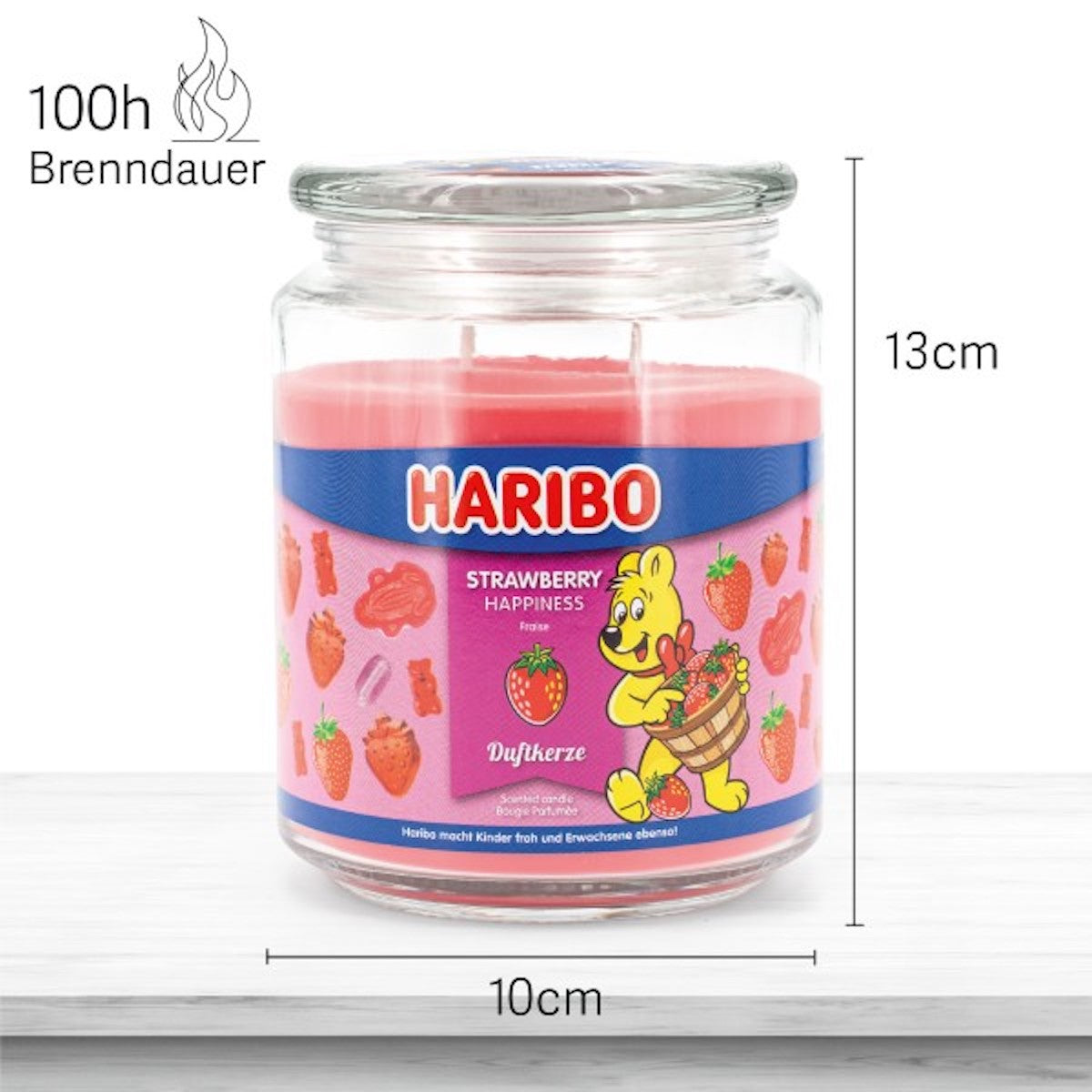 Haribo Duftkerze ‚Strawberry Happiness‘ (510g) im Glas - 13cm hoch, 10cm breit. Offizielle Lizenzkerze mit 100h Brenndauer, angenehmer Duft und liebevolles Haribo-Design. Dekoratives Wohnaccessoire und besonderes Geschenk.